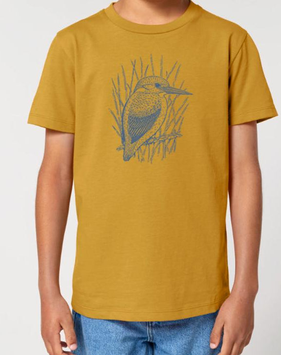 Child wearing a mustard yellow t-shirt with a graphic design on a white background