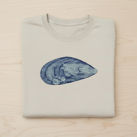 Mussel T-Shirt flat lay on natural wooden background